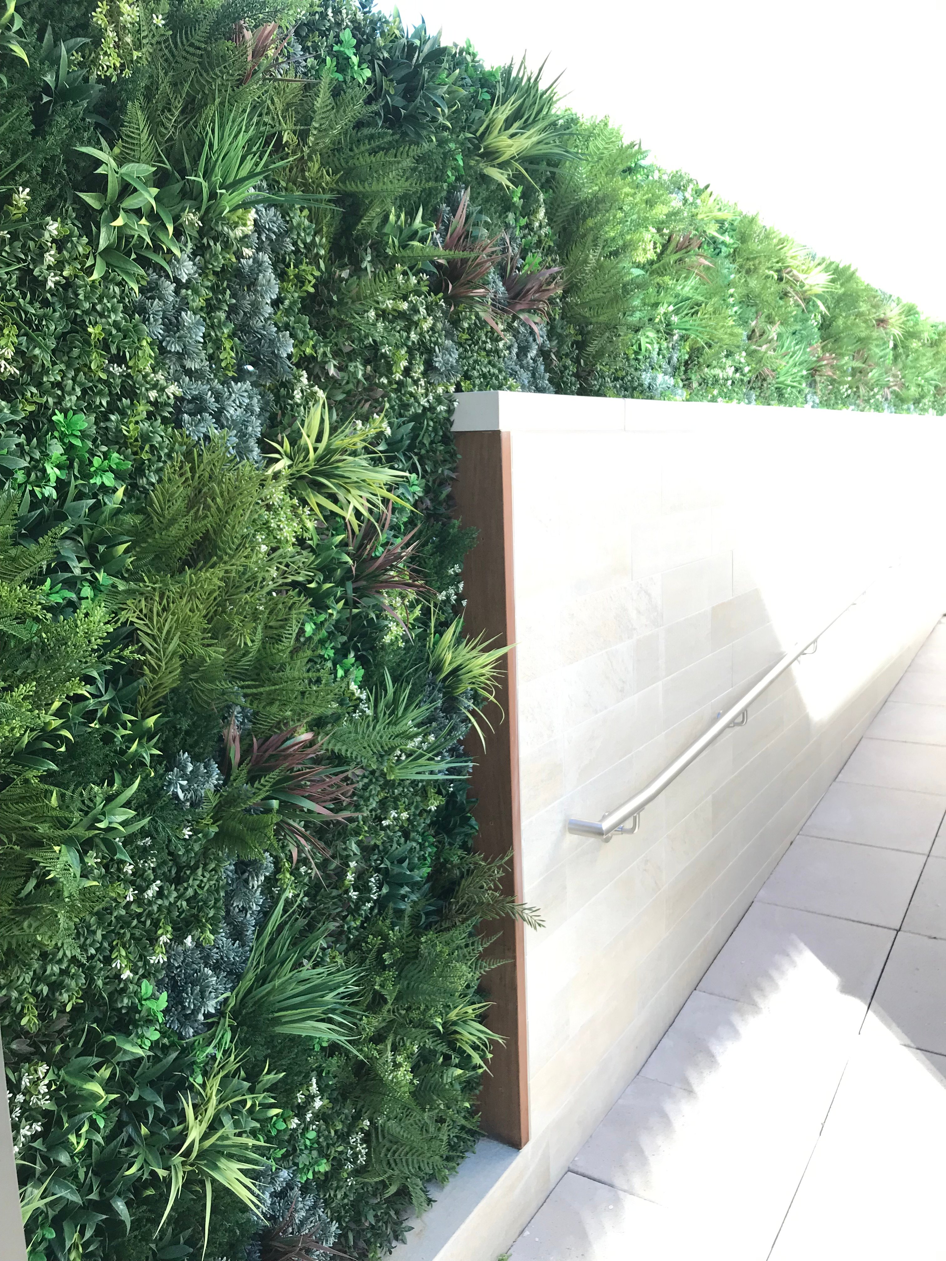 Seamless vertical garden look with green wall panels